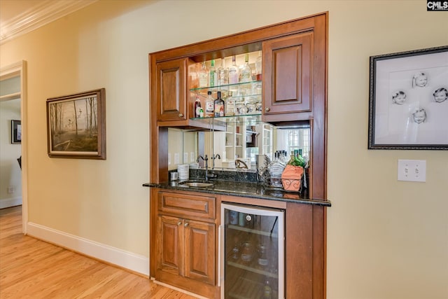 3450 Summerland Hwy, Leesville, SC 29070 - indoor wet bar featuring beverage cooler, light wood finished floors, and ornamental molding