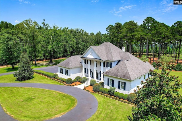 3450 Summerland Hwy, Leesville, SC 29070 - neoclassical / greek revival house featuring a front lawn, roof with shingles, curved driveway, and stucco siding