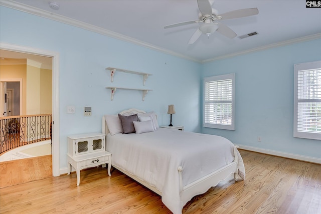 3450 Summerland Hwy, Leesville, SC 29070 - bedroom featuring multiple windows, light wood finished floors, ornamental molding, and ceiling fan