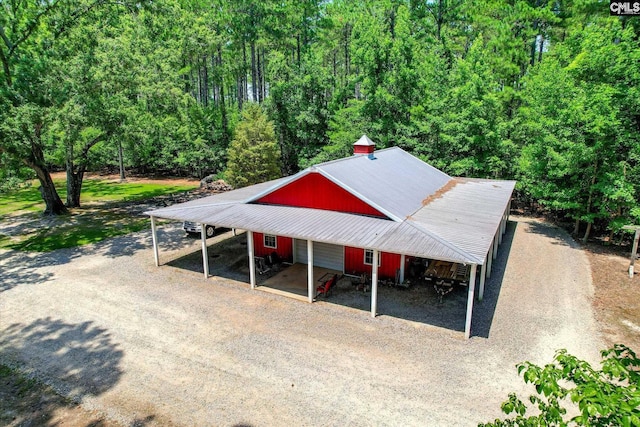 3450 Summerland Hwy, Leesville, SC 29070 - view of car parking with dirt driveway, a wooded view, and a carport