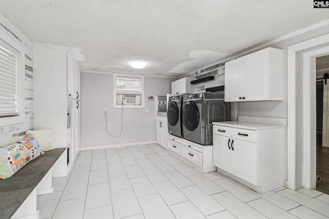 2032 Pinewood St, Cayce, SC 29033 - laundry room with washing machine and clothes dryer, cabinet space, a textured ceiling, and cooling unit