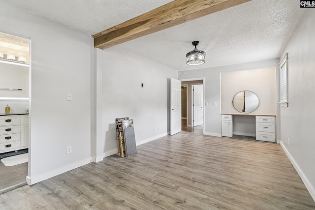 2032 Pinewood St, Cayce, SC 29033 - unfurnished living room featuring light wood-style floors and a textured ceiling