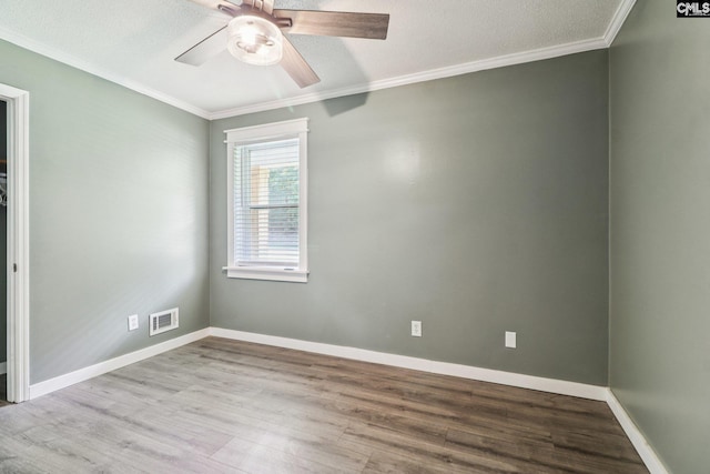 2032 Pinewood St, Cayce, SC 29033 - empty room with wood finished floors, ornamental molding, and a ceiling fan