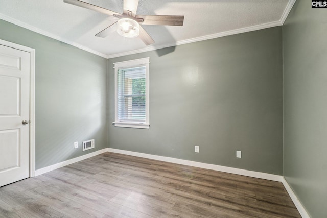 2032 Pinewood St, Cayce, SC 29033 - unfurnished room with crown molding, wood finished floors, and ceiling fan