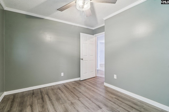 2032 Pinewood St, Cayce, SC 29033 - spare room with wood finished floors, a ceiling fan, and crown molding