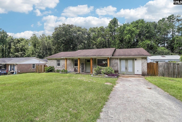 2032 Pinewood St, Cayce, SC 29033 - single story home featuring driveway, brick siding, french doors, and covered porch