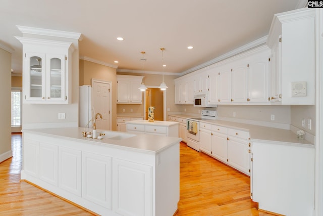 201 Arcadia Lakes Dr, Columbia, SC 29206 - kitchen featuring white appliances, ornamental molding, light wood-type flooring, white cabinets, and glass insert cabinets