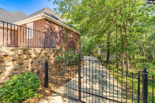 201 Arcadia Lakes Dr, Columbia, SC 29206 - view of home's exterior with brick siding and a gate