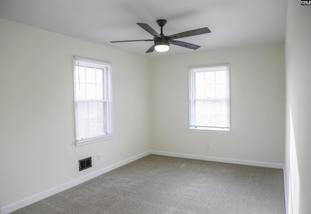 960 Curtis St, Columbia, SC 29210 - carpeted empty room with healthy amount of natural light and ceiling fan