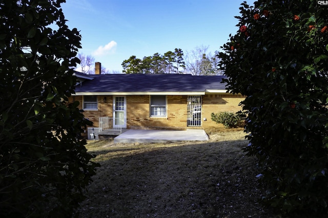960 Curtis St, Columbia, SC 29210 - rear view of property featuring brick siding and a chimney