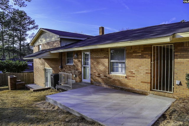 960 Curtis St, Columbia, SC 29210 - rear view of house with a patio area, brick siding, and roof with shingles
