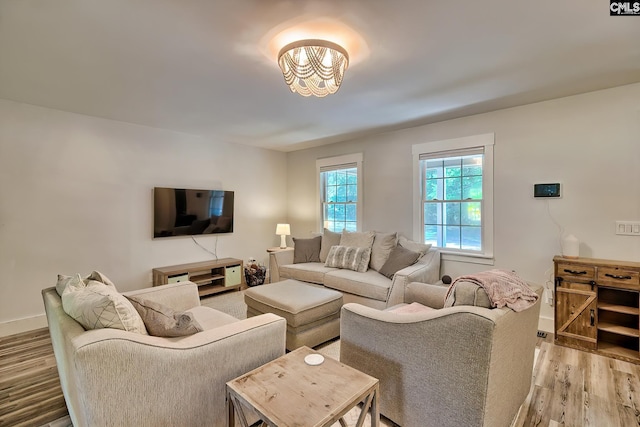 5404 Fairview Rd, Batesburg, SC 29006 - living area with light wood-style floors and a chandelier