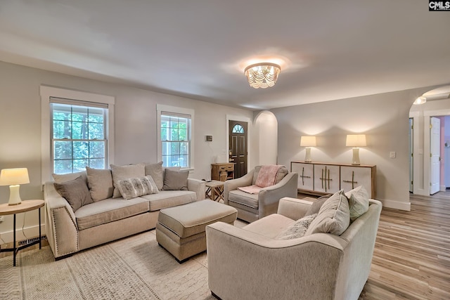 5404 Fairview Rd, Batesburg, SC 29006 - living area featuring arched walkways and light wood-style floors