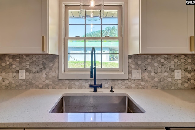 5404 Fairview Rd, Batesburg, SC 29006 - kitchen with a chandelier, white cabinetry, tasteful backsplash, and plenty of natural light