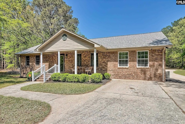 5404 Fairview Rd, Batesburg, SC 29006 - single story home with brick siding, a porch, driveway, and a shingled roof