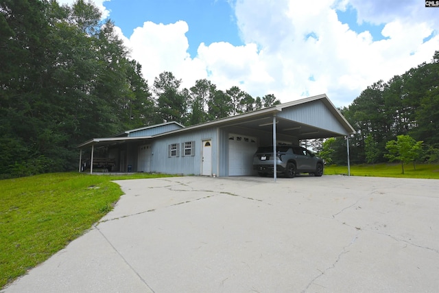 5404 Fairview Rd, Batesburg, SC 29006 - view of side of property with a yard, concrete driveway, an attached carport, and an attached garage