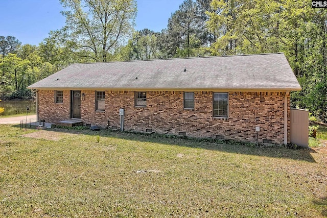5404 Fairview Rd, Batesburg, SC 29006 - view of home's exterior with a lawn, brick siding, roof with shingles, and crawl space