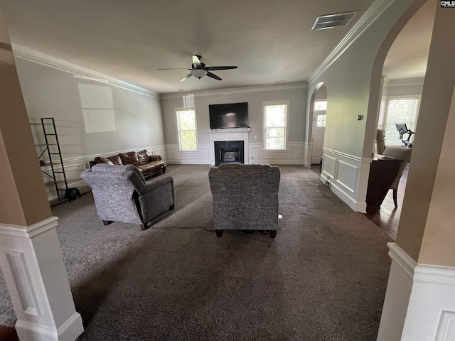 127 Brooklet Dr, Lexington, SC 29072 - living area featuring a decorative wall, arched walkways, a ceiling fan, dark colored carpet, and ornamental molding