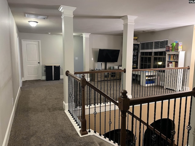 127 Brooklet Dr, Lexington, SC 29072 - hallway with an upstairs landing, ornate columns, and carpet floors
