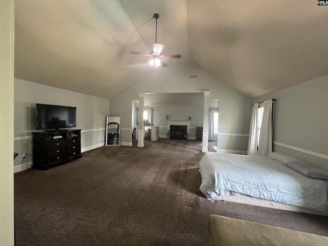 127 Brooklet Dr, Lexington, SC 29072 - bedroom with dark colored carpet, lofted ceiling, and a fireplace