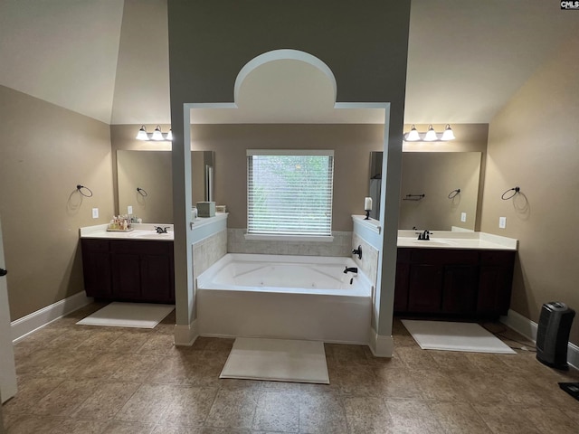 127 Brooklet Dr, Lexington, SC 29072 - full bathroom with a jetted tub, two vanities, and lofted ceiling