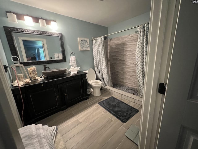 127 Brooklet Dr, Lexington, SC 29072 - bathroom featuring vanity, a tile shower, and wood finish floors