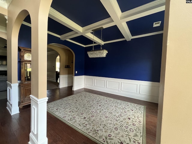 127 Brooklet Dr, Lexington, SC 29072 - dining room featuring coffered ceiling, beamed ceiling, arched walkways, dark wood finished floors, and wainscoting