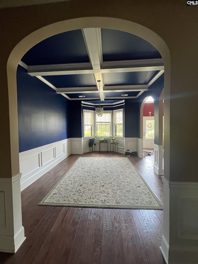 127 Brooklet Dr, Lexington, SC 29072 - spare room featuring coffered ceiling, arched walkways, a decorative wall, a wainscoted wall, and beamed ceiling