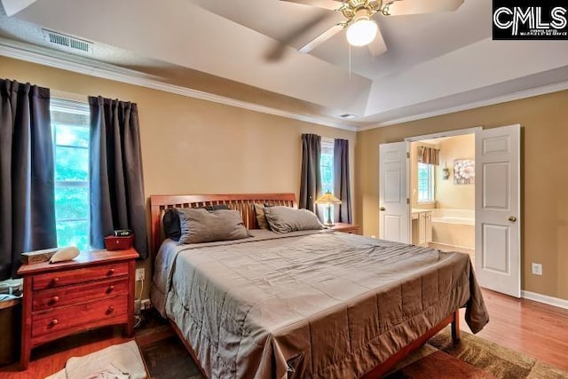 211 Lothrop Hill Rd, Lexington, SC 29072 - bedroom featuring a raised ceiling, wood finished floors, crown molding, connected bathroom, and a ceiling fan