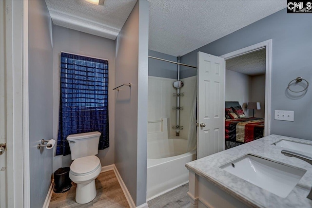 27 Lacebark Ln, Elgin, SC 29045 - bathroom with a textured ceiling, wood finished floors, bathing tub / shower combination, double vanity, and ensuite bathroom