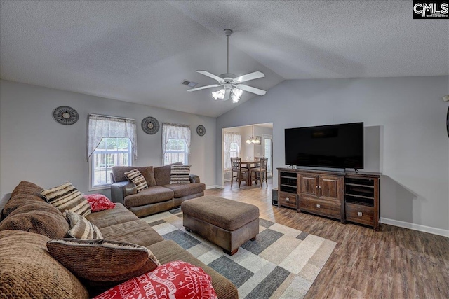 27 Lacebark Ln, Elgin, SC 29045 - living area featuring wood finished floors, lofted ceiling, a ceiling fan, a textured ceiling, and a chandelier