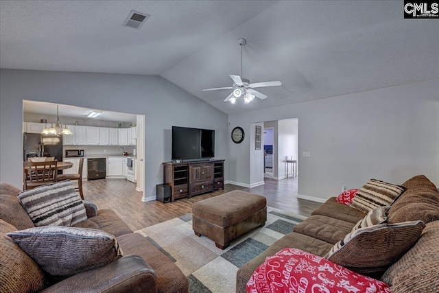 27 Lacebark Ln, Elgin, SC 29045 - living room featuring wood finished floors, a ceiling fan, lofted ceiling, and a chandelier