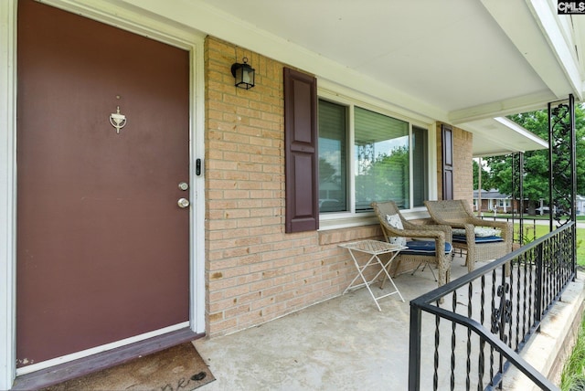1159 Starview Dr, West Columbia, SC 29172 - view of exterior entry with a porch and brick siding