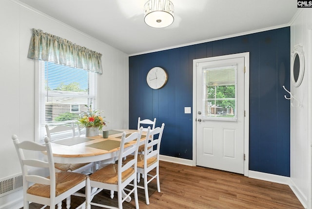 1159 Starview Dr, West Columbia, SC 29172 - dining space featuring crown molding, healthy amount of natural light, and wood finished floors