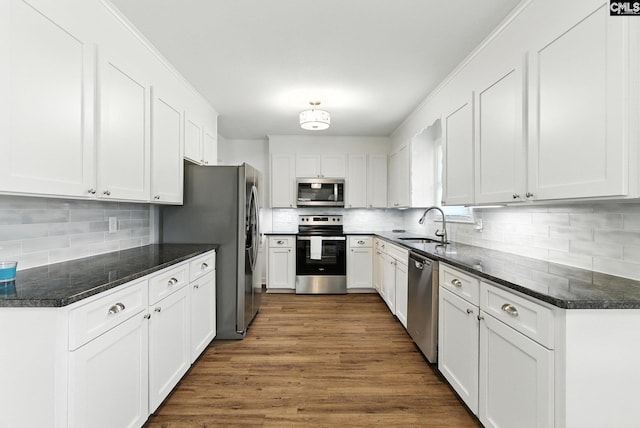 1159 Starview Dr, West Columbia, SC 29172 - kitchen with appliances with stainless steel finishes, backsplash, and white cabinets