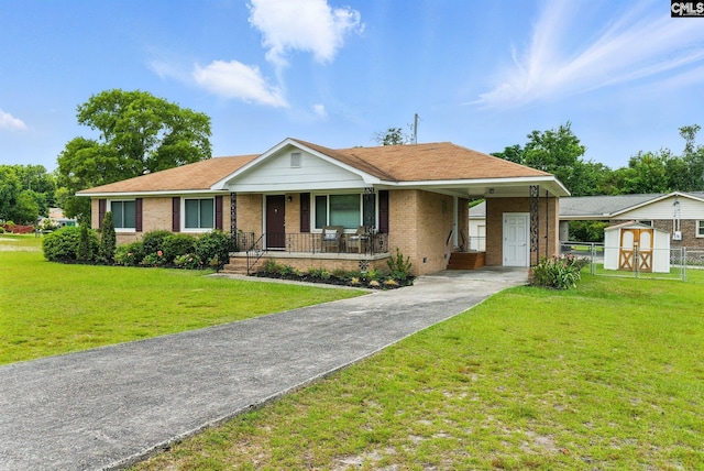 1159 Starview Dr, West Columbia, SC 29172 - single story home with brick siding, concrete driveway, a shed, a porch, and a carport