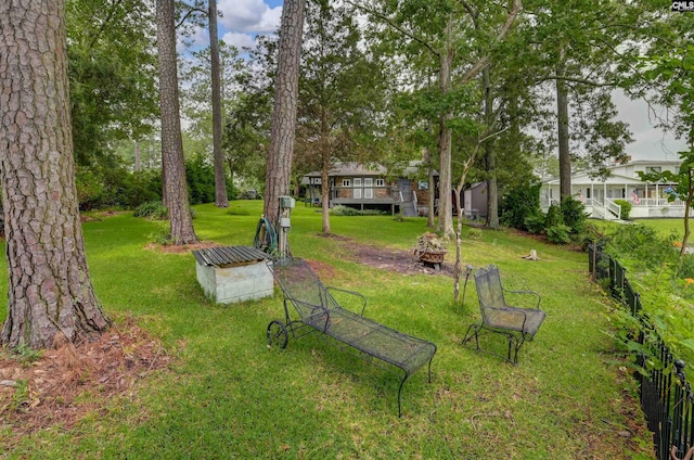 648 E Point Dr, Gilbert, SC 29054 - view of grassy yard featuring an outdoor fire pit