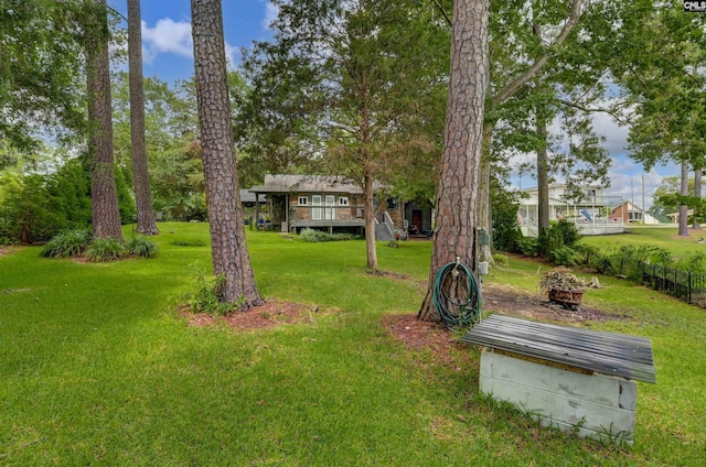 648 E Point Dr, Gilbert, SC 29054 - view of yard featuring a deck and a fire pit