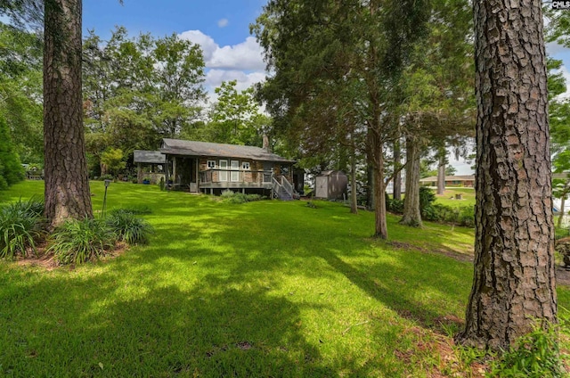 648 E Point Dr, Gilbert, SC 29054 - view of green lawn with a deck, a storage shed, and stairway