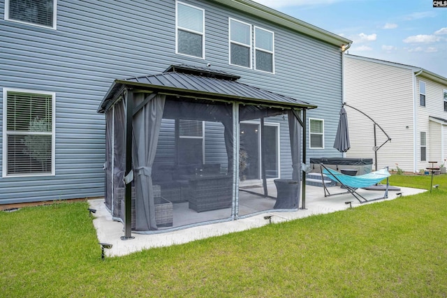 181 Prismatic Way, Lexington, SC 29072 - rear view of house featuring a gazebo, a sunroom, a lawn, and a patio area