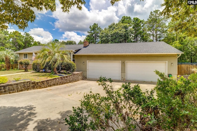 1037 Ridgeview Cir, Elgin, SC 29045 - ranch-style home featuring driveway, a garage, and a chimney