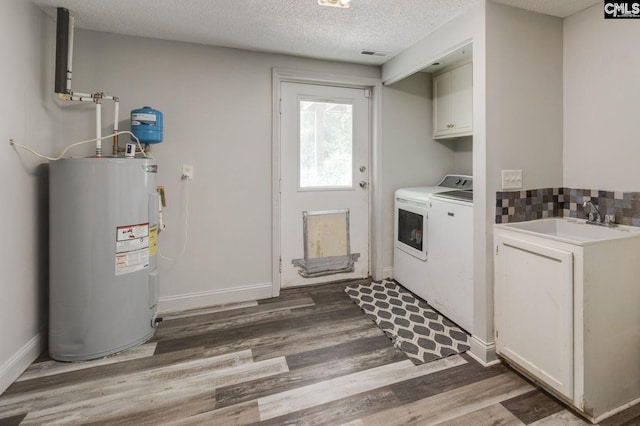 1037 Ridgeview Cir, Elgin, SC 29045 - laundry area with water heater, cabinet space, independent washer and dryer, wood finished floors, and a textured ceiling
