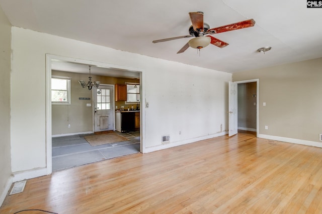 2900 N Beltline Blvd, Columbia, SC 29204 - empty room featuring light wood-type flooring, ceiling fan, and a chandelier