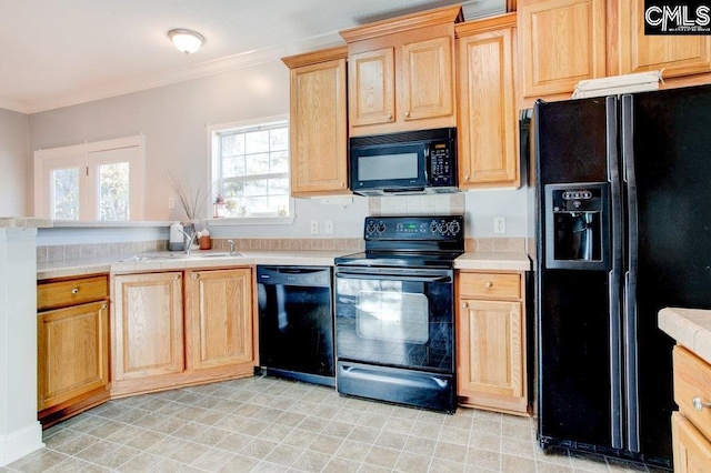 kitchen featuring crown molding, sink, black appliances, and light tile floors