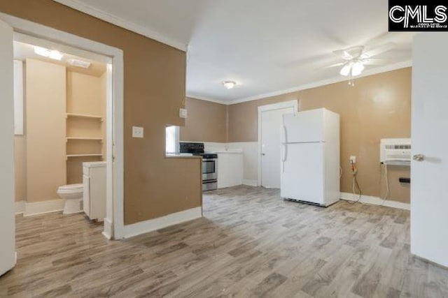 kitchen featuring white fridge, light wood-type flooring, ceiling fan, and stainless steel electric range