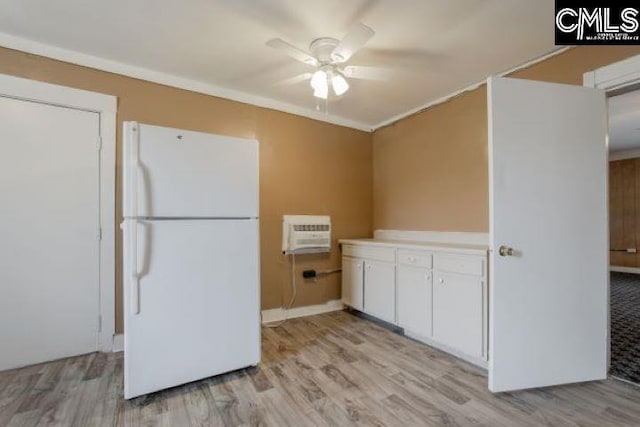 kitchen with white cabinets, ceiling fan, white fridge, and light wood-type flooring