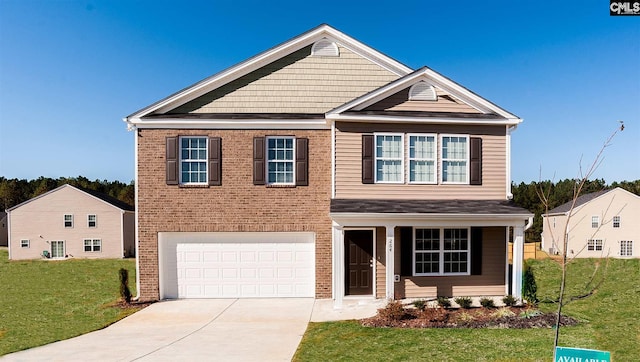 view of front of house with a front yard and a garage