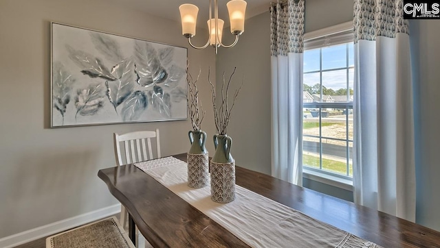 dining space with a chandelier