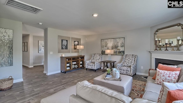 living room featuring dark wood-type flooring