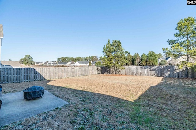 view of yard with a patio and a fire pit